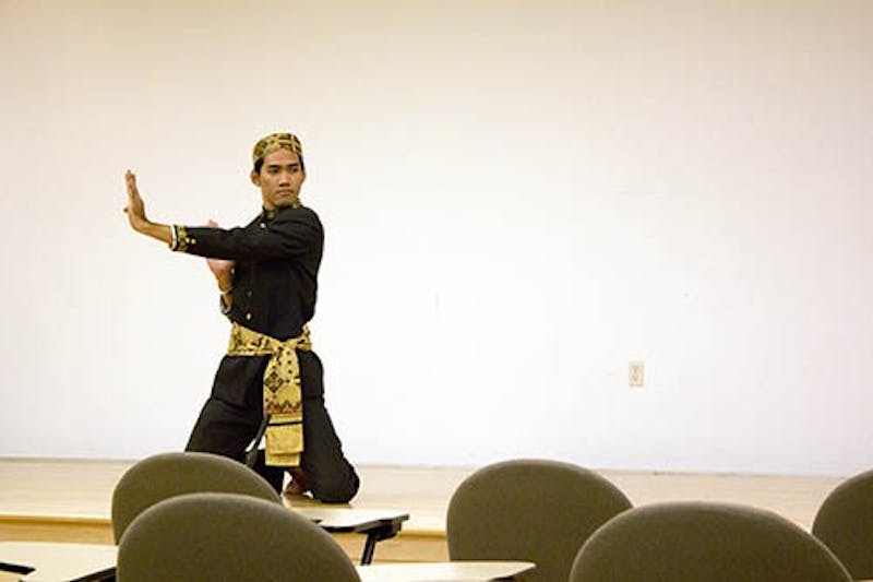 Zacky Anderson, an English literature major from Jakarta, Indonesia, performs a dance native from his country. The dance was part of the Study of the U.S. Institute program. DN PHOTO ROSS MAY