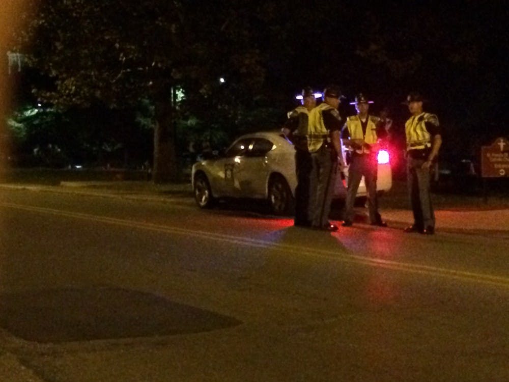 State police stop cars on New York Ave. near campus looking for drunk drivers. The checkpoint was part of the state's Drive Sober or Get Pulled Over campaign that ends after Labor Day weekend. DN PHOTO CHRISTOPHER STEPHENS