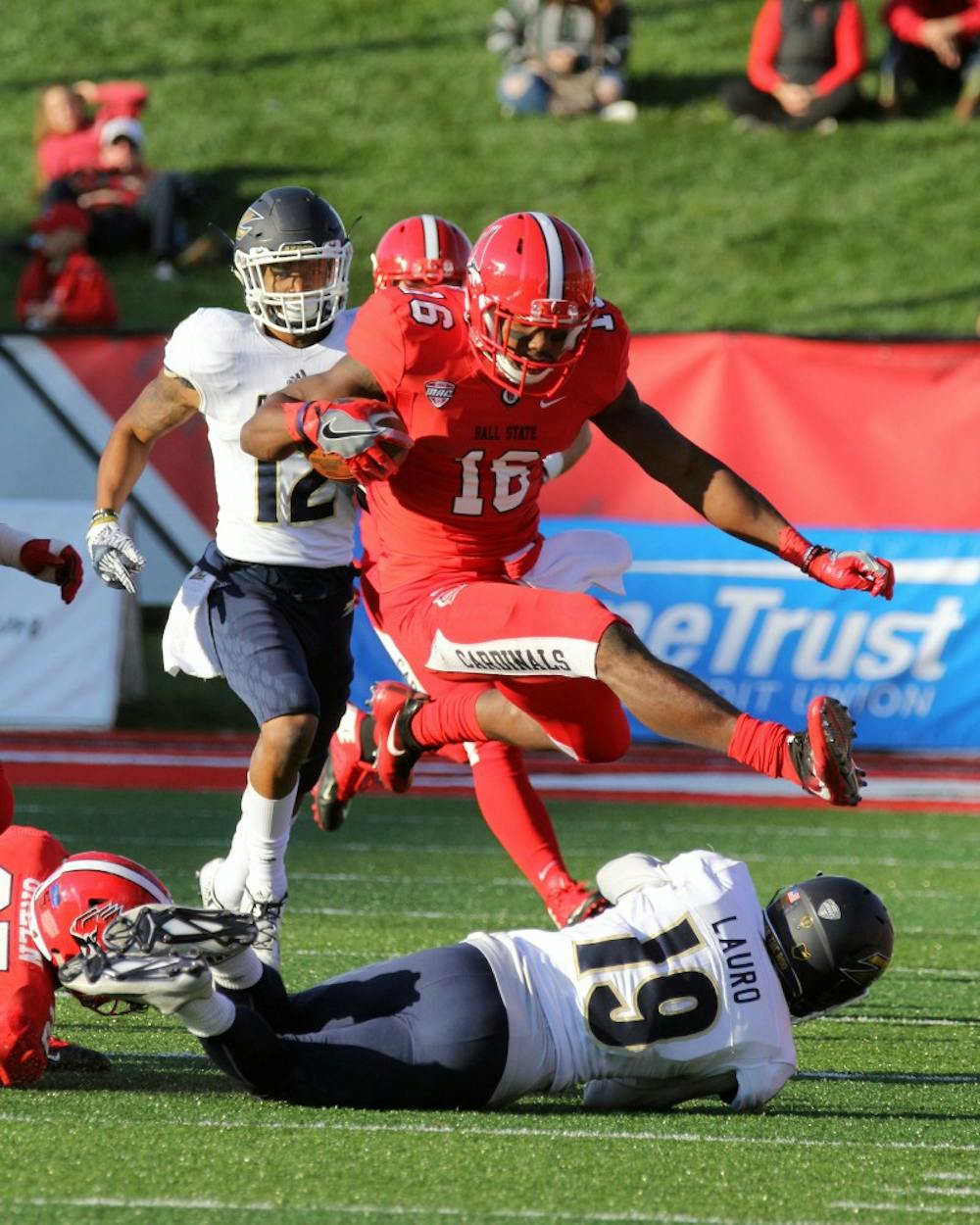 Wide receiver KeVonn Mabon hurdles a defender during the Cardinals’ game against Akron on Oct. 22 in Scheumann Stadium. Ball State lost 25 to 35. Paige Grider// DN