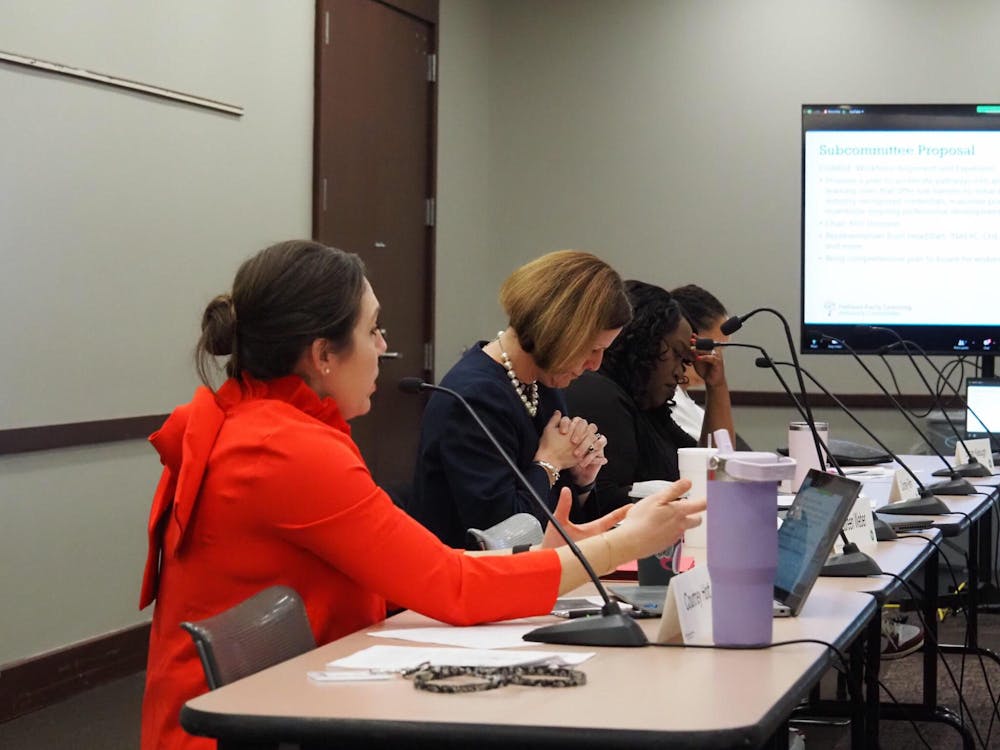 �������������������������������Courtney Hott, the director of ELAC, outlines a subcommittee on childcare workforce issues before the Early Learning Advisory Committee (ELAC) on Dec. 20, 2023. (Whitney Downard/Indiana Capital Chronicle)