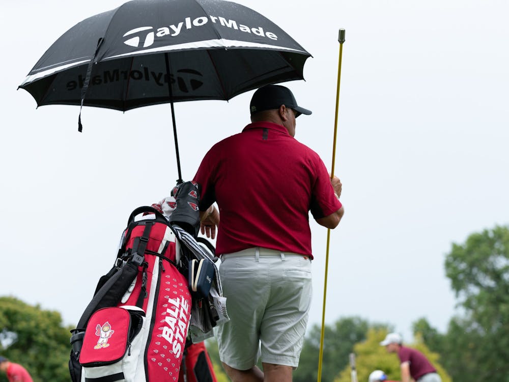 Ball State Men's Golf Head Coach Mike Fleck stands under an umbrella at hole eleven during the Earl Yestingmeier Invite Sep. 3 at the Delaware Country Club. Hosted by the Delaware Country Club, the 2022 Earl Yestingsmeire Invite had 15 teams from schools across the region competing on the par-70 course. Eli Houser, DN