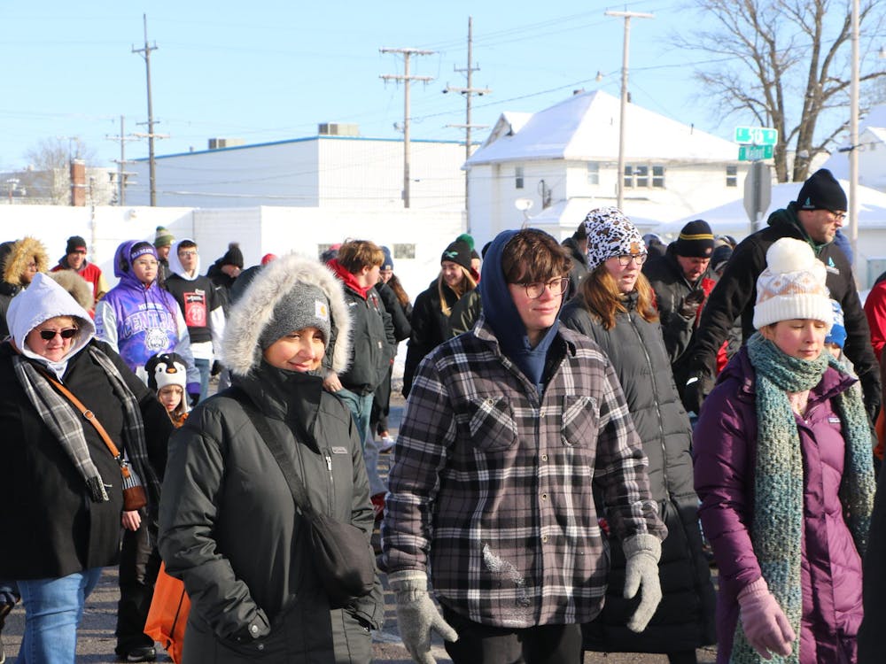 Muncie community members participate in Muncie Missions 'Walk a Mile in My Shoes' event, Feb. 17. The event raises awareness for local homelessness. Zach Gonzalez, DN.