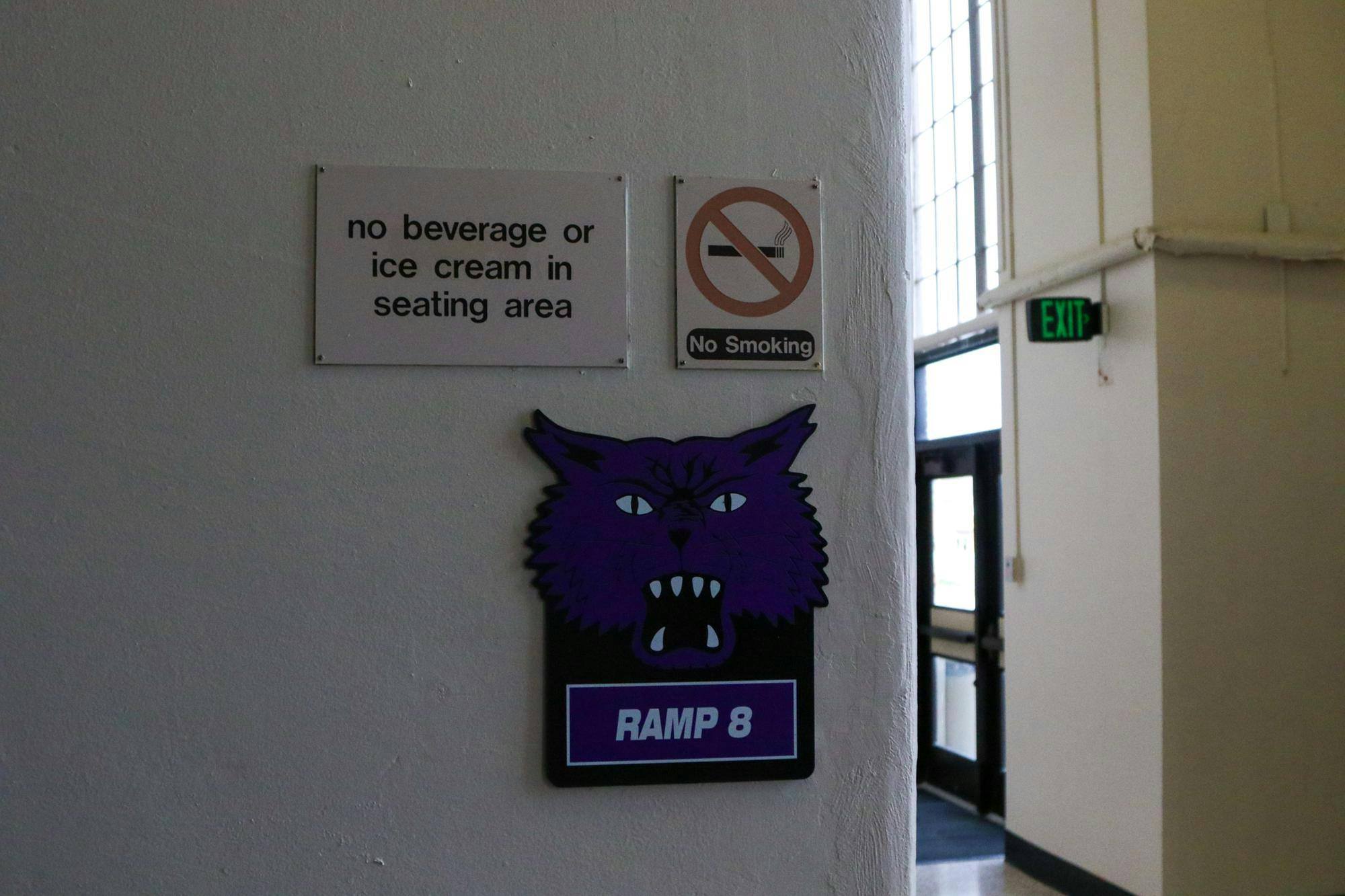 Old signs promoting the Muncie Fieldhouse's rules concerning smoking and seating area etiquette hang in a tunnel Sunday, April 7. The Muncie Fieldhouse is 96 years old. Kyle Smedley, DN