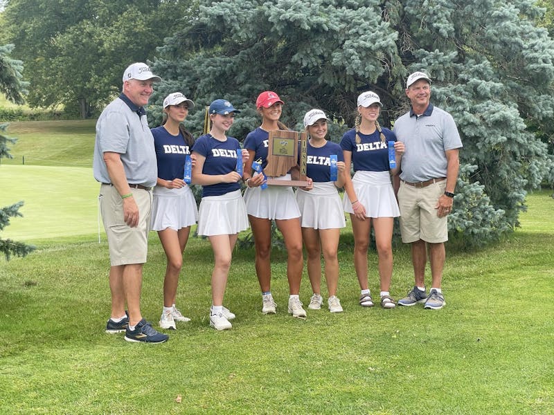 The Delta girls golf team poses with the sectional trophy September 16 during the Muncie Central Sectional at Crestview Golf Club. Zach Carter, DN.
