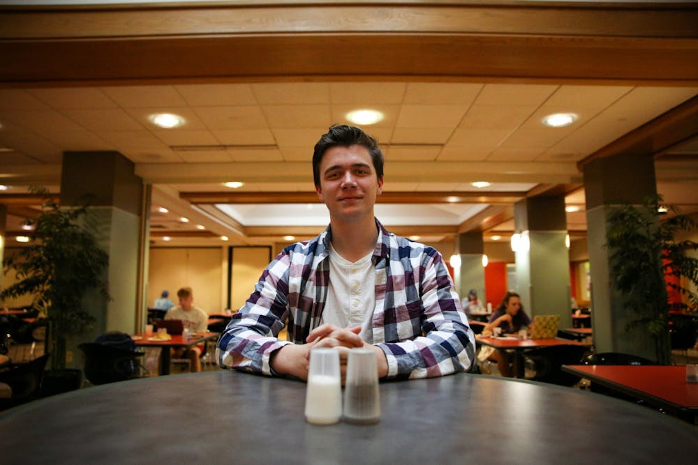 Freshman sports production major Jackson Divincenzo sits at a table at Noyer Dining Apr. 12. Divincenzo frequents the dining hall and enjoys the stir fry. Jacy Bradley, DN