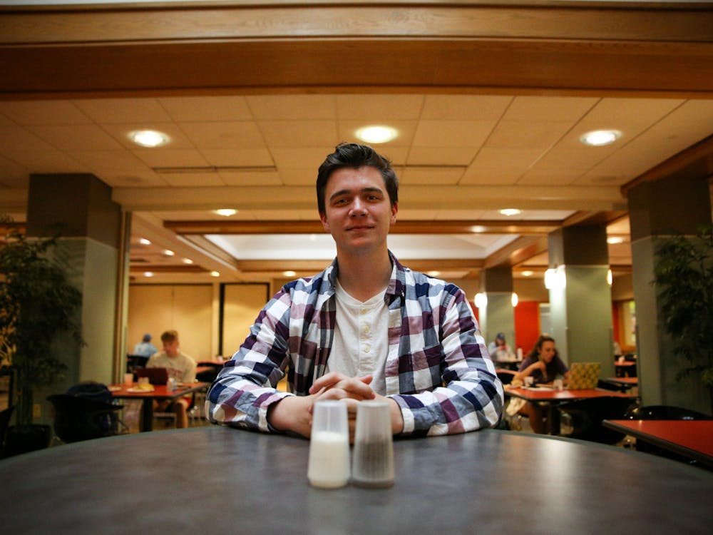 Freshman sports production major Jackson Divincenzo sits at a table at Noyer Dining Apr. 12. Divincenzo frequents the dining hall and enjoys the stir fry. Jacy Bradley, DN