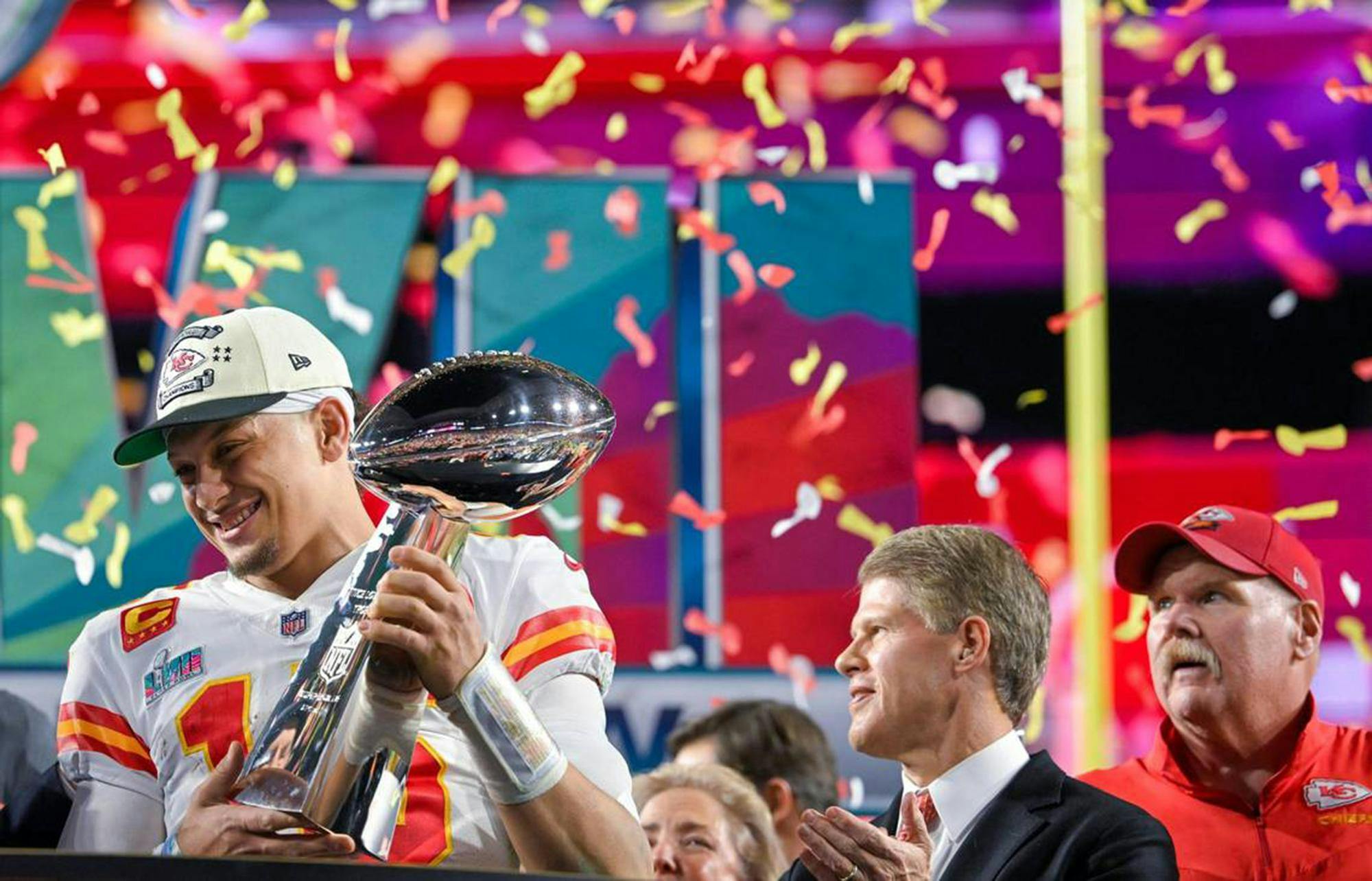 Kansas City Chiefs quarterback Patrick Mahomes (15) hoists the Lombardi Trophy after leading the Chiefs to a Super Bowl LVII victory, 38-35, over the Philadelphia Eagles on Sunday, Feb. 12, 2023, at State Farm Stadium in Glendale, Arizona. Chiefs Chairman &amp; CEO Clark Hunt and head coach Andy Reid look on. (Tammy Ljungblad/The Kansas City Star/TNS)