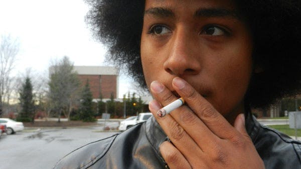 Christian Myles, a freshman telecommunications and theatre major, takes a smoke break in the LaFollette and Johnson Hall smoking section. The Smoke Free Ball State task force discussed Dec. 4 to broaden the smoking ban on campus. DN PHOTO EMMA FLYNN