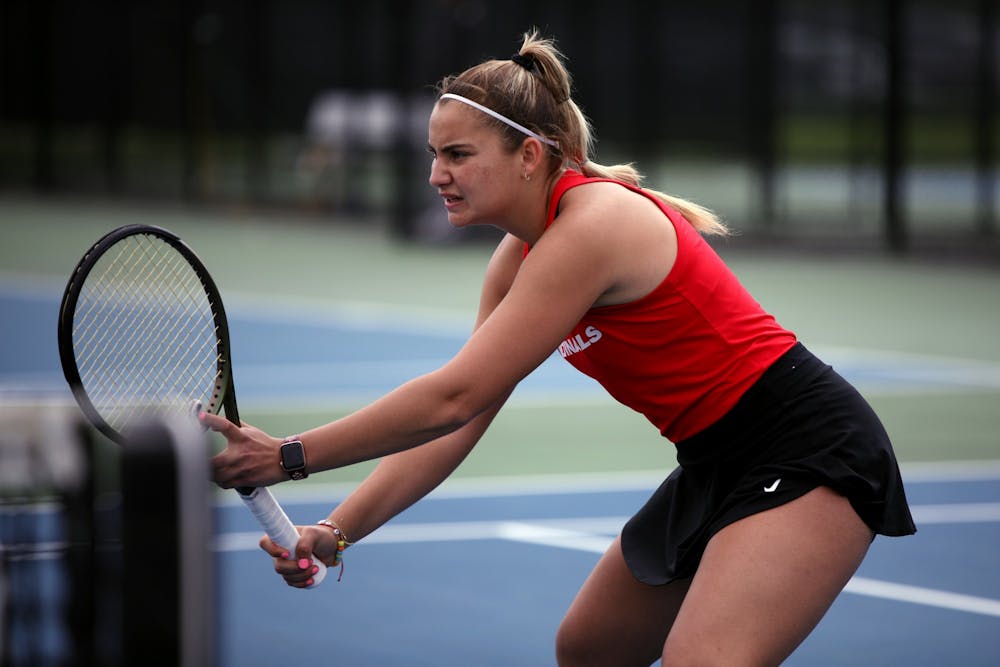 Junior Amy Kaplan prepares for the ball to be served in a MAC Championship doubles match against Toledo May 1 at Cardinal Creek Tennis Courts. Amber Pietz, DN