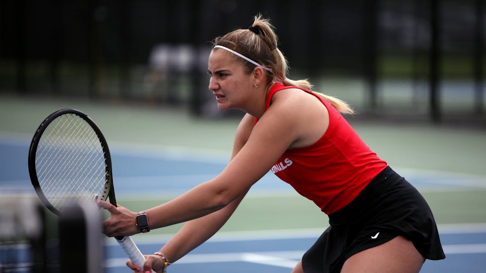 Junior Amy Kaplan prepares for the ball to be served in a MAC Championship doubles match against Toledo May 1 at Cardinal Creek Tennis Courts. Amber Pietz, DN