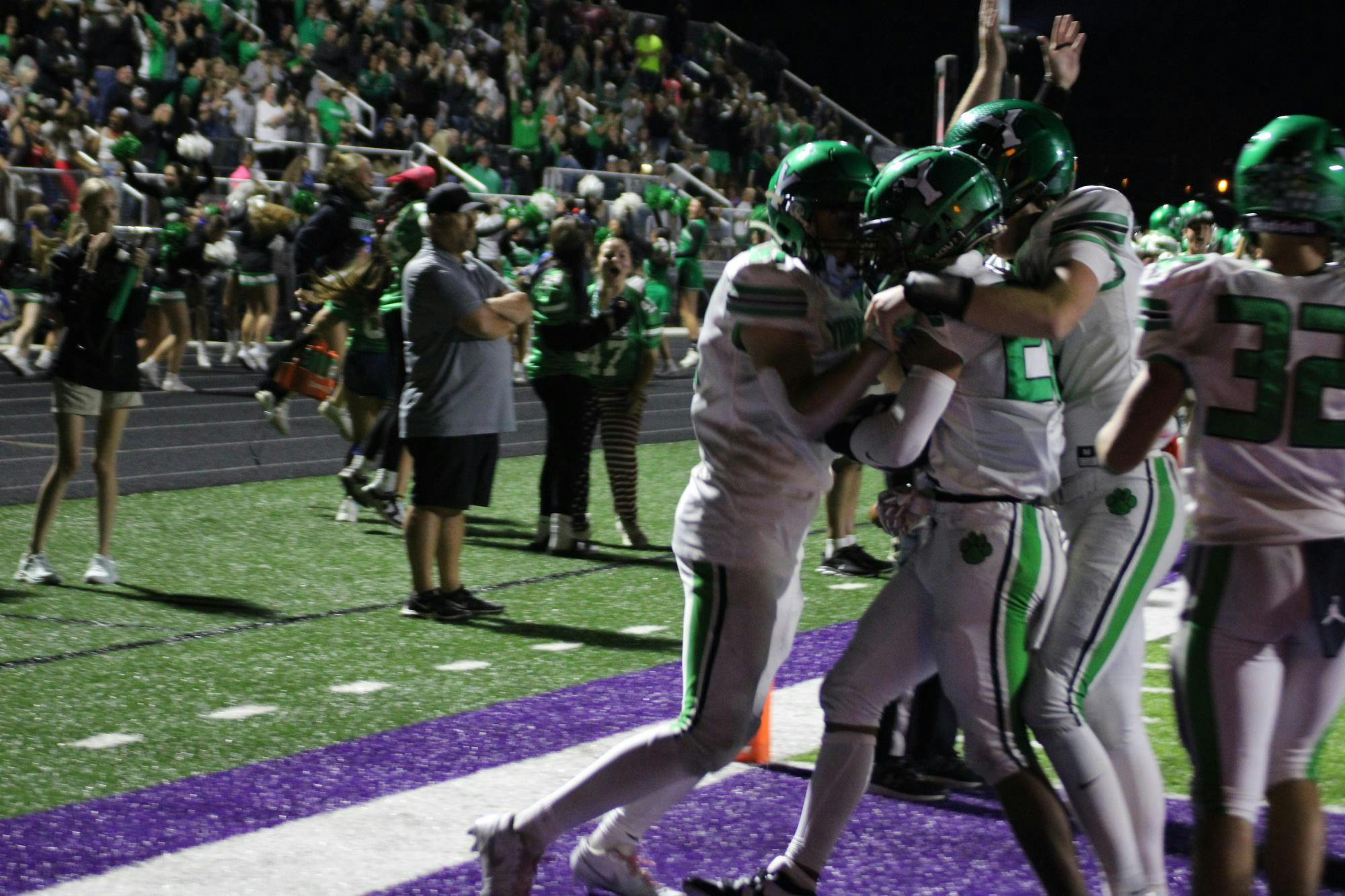Kaden Crumes is embraced by his teammates after scoring his second TD of the night during their game against Muncie Central on Aug. 29, 2025. This touchdown would be the winning score as Yorktown prevailed 15-12. Photo by Aiden Riegle