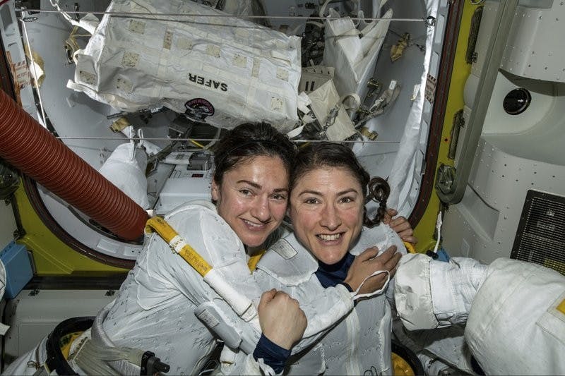 In this photo released by NASA on Friday, Oct. 18, 2019, U.S. astronauts Jessica Meir, left, and Christina Koch pose for a photo in the International Space Station. The astronauts who took part in the first all-female spacewalk are still uplifted by all the excitement down on Earth. (NASA via AP)