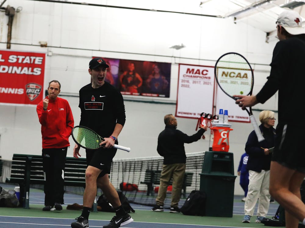 Freshman Drew Hayward celebrates with teammate  Vince Orlando during a doubles match against Eastern Illinois Jan. 20 at YMCA in Muncie. Ball State men's tennis won 7-0 against Eastern Illinois. Mya Cataline, DN
