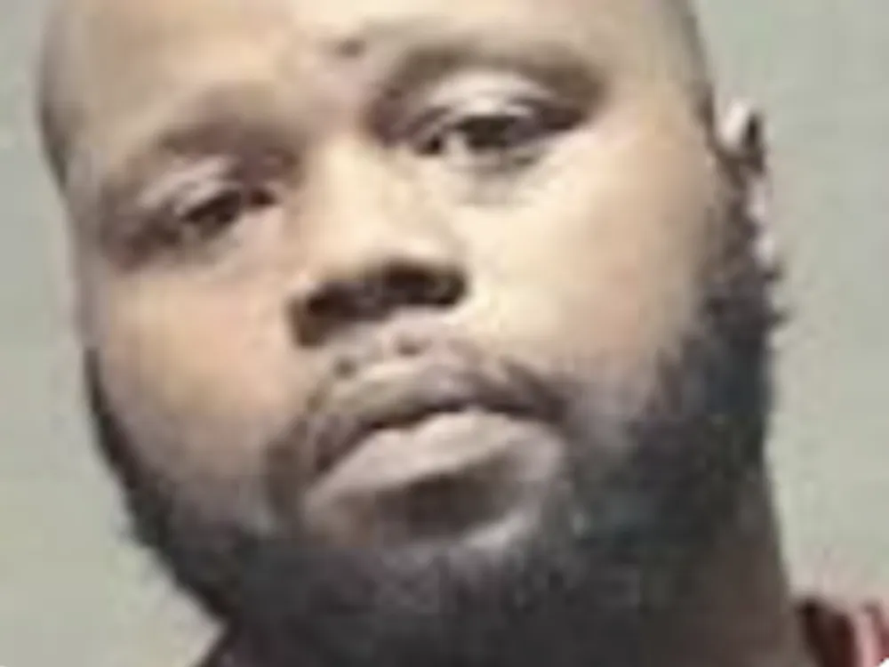 Allie Lee McCroy, 33, of Muncie was arrested late Wednesday under several charges including possession of illegal drugs and firearms.