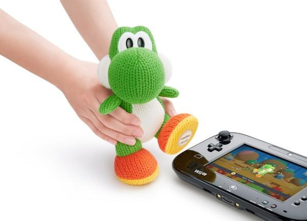 Users will be able to scan Mega Yarn Yoshi's foot in order to gain a power-up in Yoshi's Wooly World