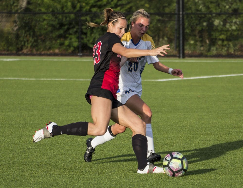 Ball State forward Sam Kambol protects the ball from Morehead State's midfielder Haley Best during the game on Sept. 16 at the Briner Sports Complex. Ball State won 4-0. Grace Ramey // DN