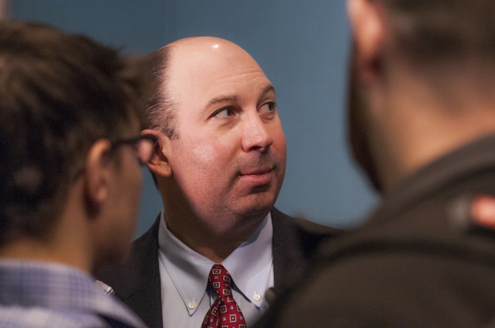 Head coach Pete Lembo talks with press in small groups after the main press conference Jan. 3 at the Mobile Convention Center in Mobile, Ala. DN PHOTO JONATHAN MIKSANEK
