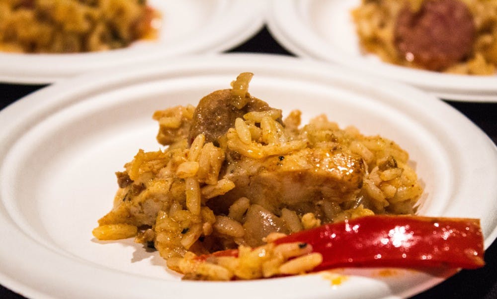Students try Spanish paella in the Student Center Tally Food Court for the Amazing Taste food fair on Nov. 3. The event also featured bug tastings, an exotic animal show, cultural displays, student performances and more. Grace Ramey // DN