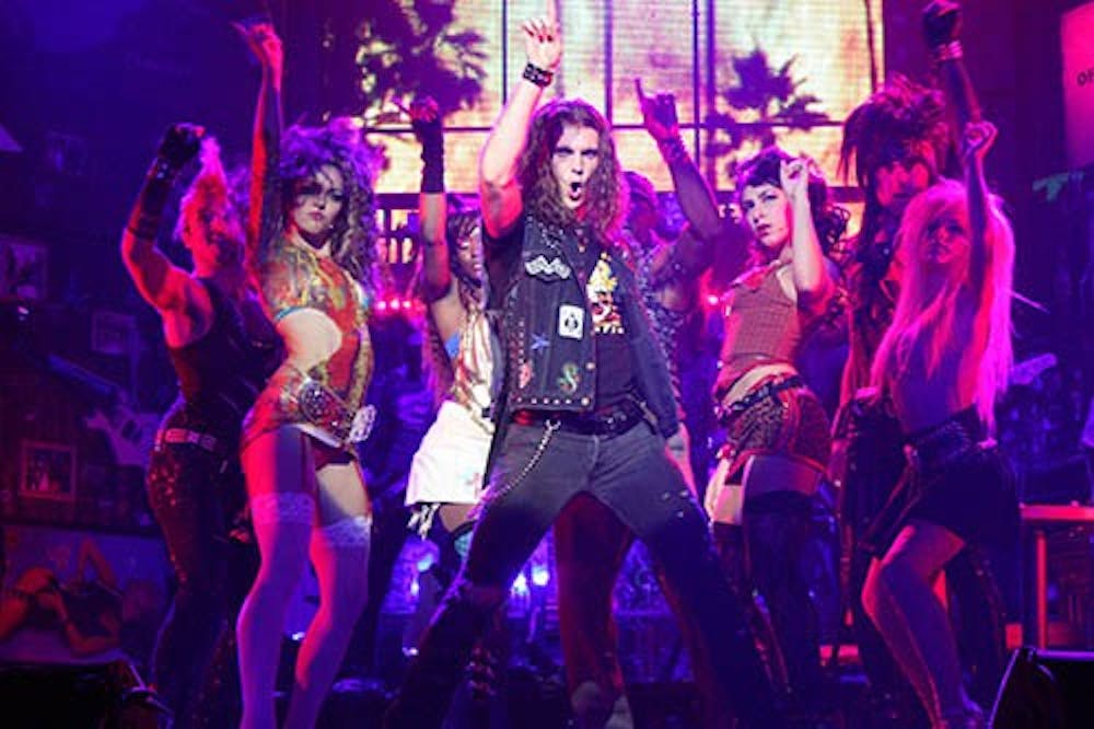 The cast of “Rock of Ages” strikes a pose during a performance. The show is built around the glam metal bands of the 1980s. PHOTO PROVIDED BY KATE EGAN