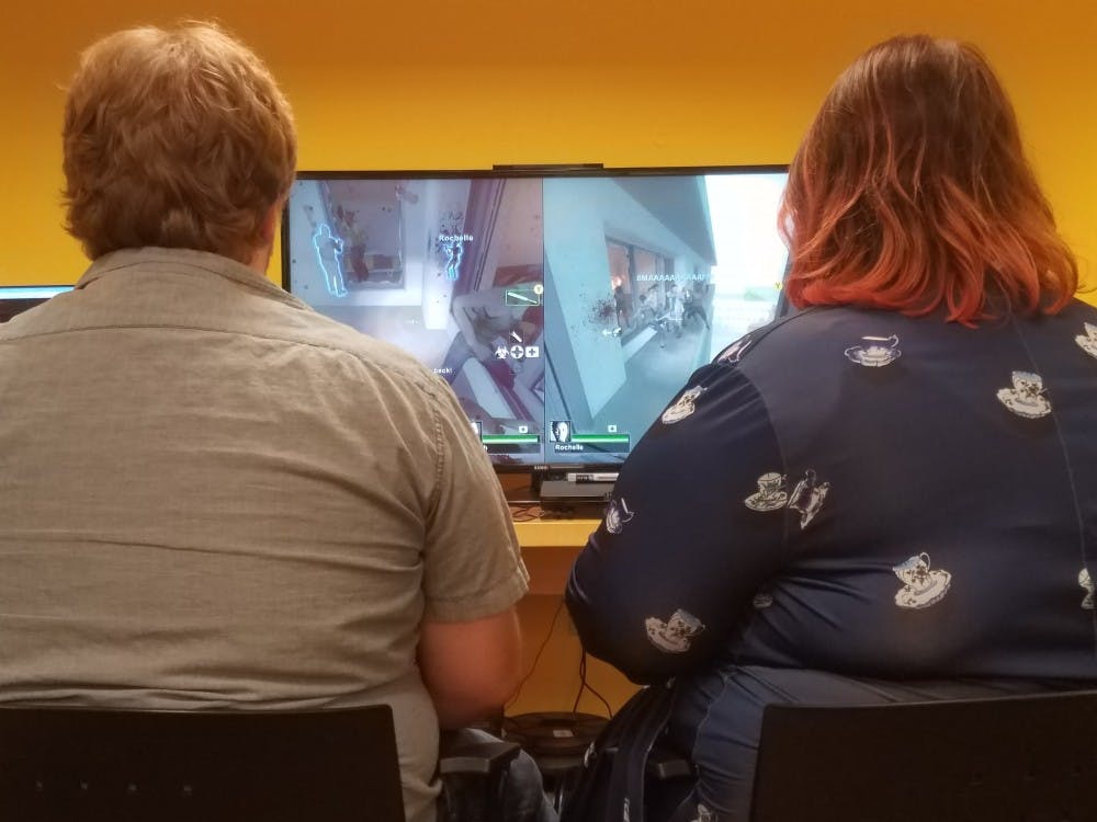 <p>"Rated M," a new adult gaming group created by the Muncie Public Library, had their first event in the&nbsp;Maring-Hunt Library on Oct. 5. The group played the video game Left 4 Dead 2 to experience the zombie genre.<em> Patrick Calvert // DN</em></p>