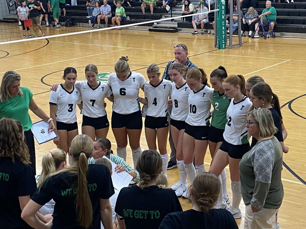 Tigers huddle up to come together to talk about what's going on. Tigers win a hard fought battle