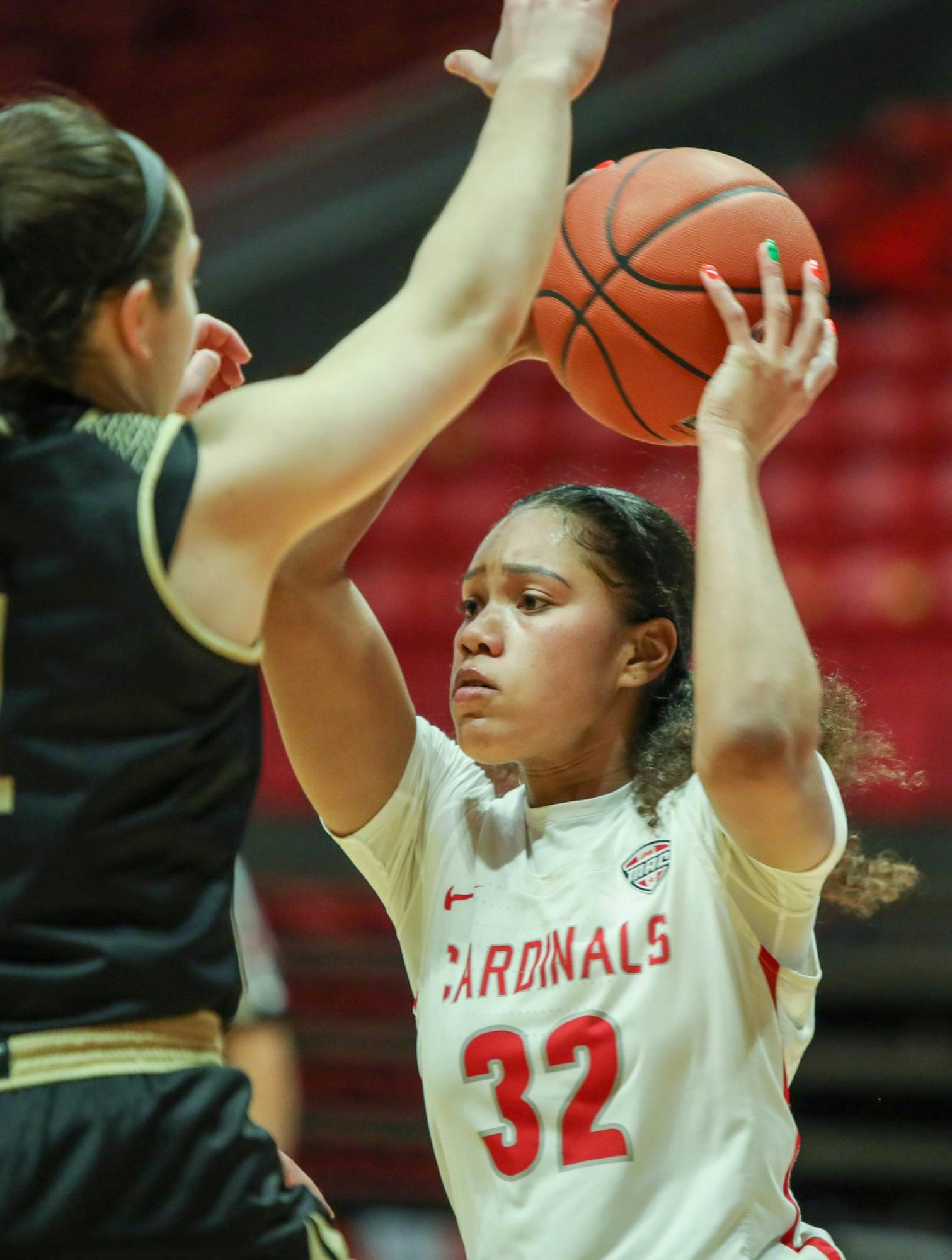 Senior forward Oshlynn Brown passes the ball March 6, 2021, in John E. Worthen Arena. The Cardinals beat the Broncos 76-69. Jaden Whiteman, DN