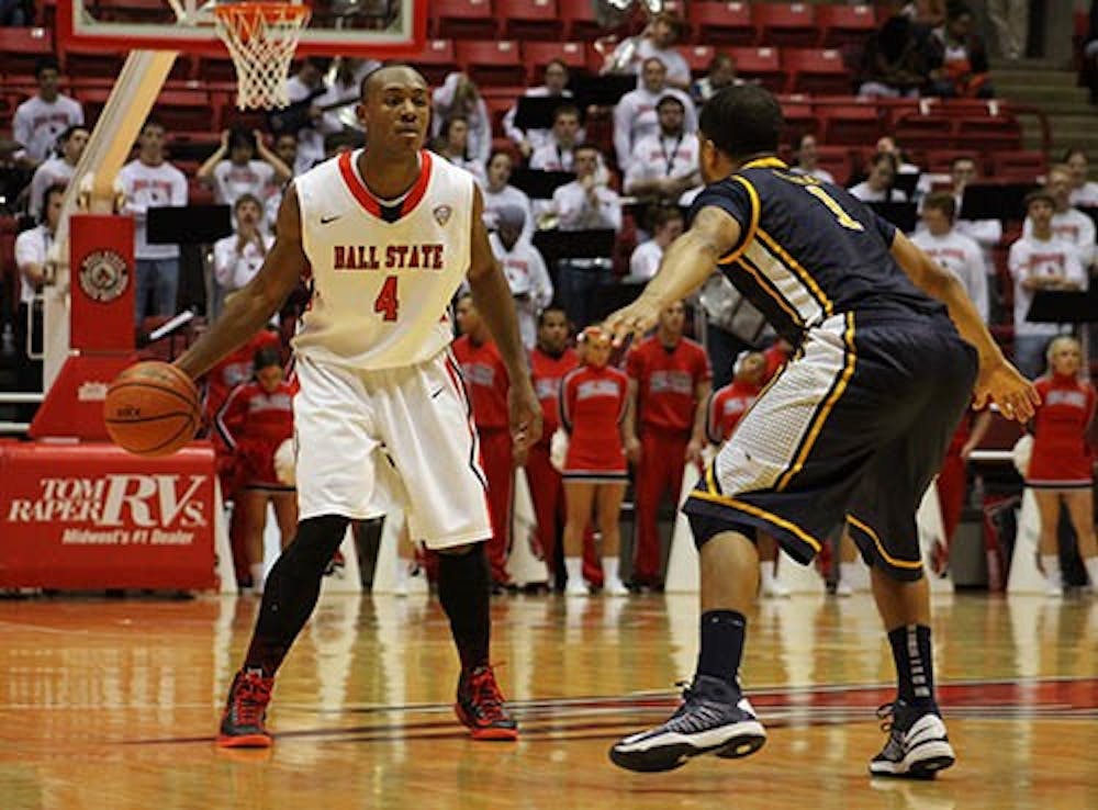 Senior guard, Jauwan Scaife dribbles the ball down the court against a Toledo defender Wednesday night. Scaife finished the night with 23 points. DN PHOTO JACQUELYN BRAZZALE