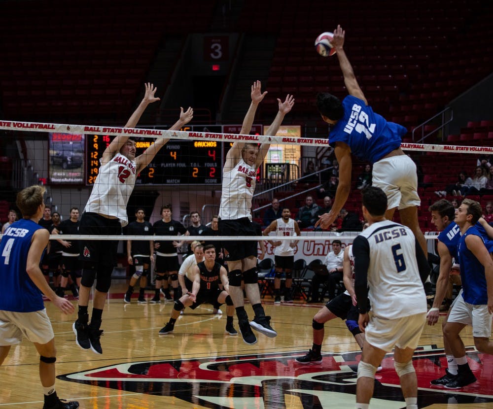 Junior Jake Romano and senior Parker Swartz jump to block a spike by Freshman Amador Sow, Jan. 18, 2019 at John E. Worthen Arena. Ball State lost to Santa Barbara 2-3. Rebecca Slezak,DN