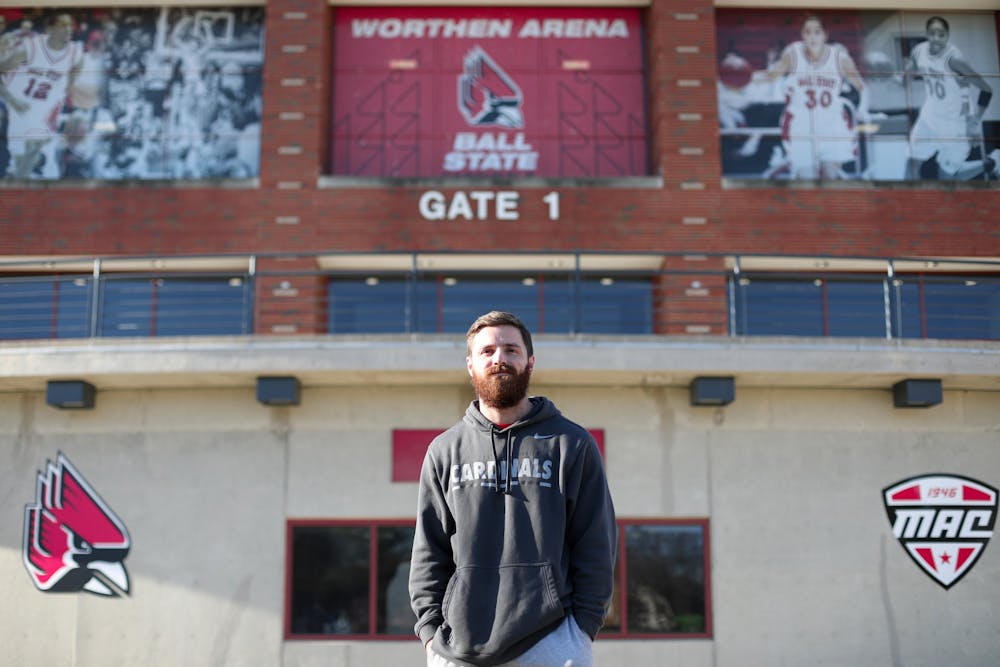 Graduate Assistant Matt Corn poses in front of Worthen Arena Nov. 9. Jacy Bradley, DN