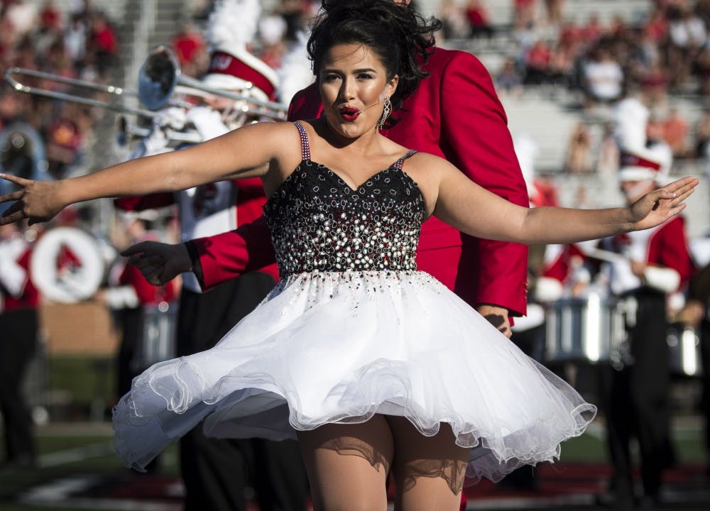 <p>A member of University Singers performs duirng the halftime show with the Pride of Mid-America marching band, Oct. 21 at Scheumann Stadium during the Homecoming football game against Central Michigan. Ball State lost to Central Michigan, 9-56.<strong> Grace Hollars, DN&nbsp;</strong></p>