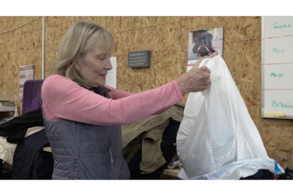Mary Ippel volunteering in the clothing room of Muncie Mission