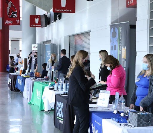 Ball State students talk with employers about opportunities at the Cardinal Job Fair at Worthen Arena, Feb. 16. Hundreds of students attend every semester to meet potential employers. Richard Kann, DN.