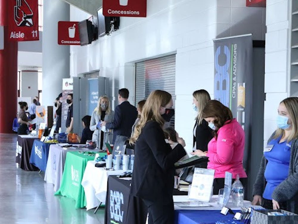 Ball State students talk with employers about opportunities at the Cardinal Job Fair at Worthen Arena, Feb. 16. Hundreds of students attend every semester to meet potential employers. Richard Kann, DN.