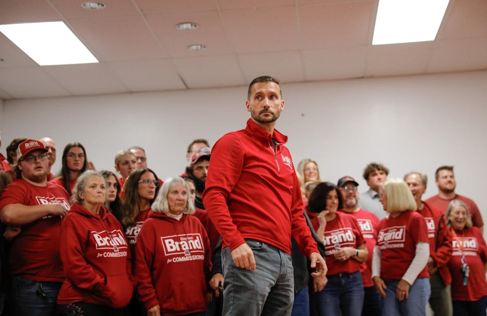 <p>Deleware County Commissioner nominee winner Stephen Brand stands in front of his family and campaign supporters Nov. 5 at the Knights of Columbus in Muncie, Ind. Andrew Berger, DN</p>