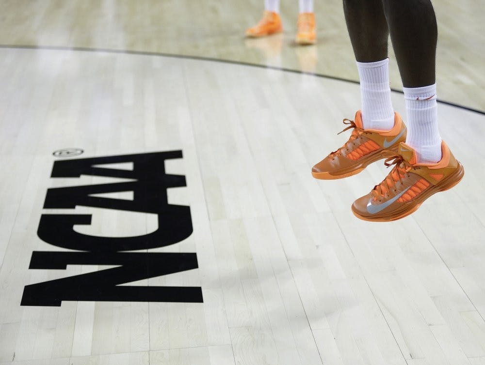 <p>FILE - In this March 21, 2013, file photo, an athlete jumps near the NCAA logo during practice for a second-round game of the NCAA college basketball tournament in Austin, Texas. Defying the NCAA, California's governor signed a first-in-the-nation law Monday, Sept. 30, that will let college athletes hire agents and make money from endorsements — a move that could upend amateur sports in the U.S. and trigger a legal challenge. <strong>(AP Photo/Eric Gay, File)</strong></p>