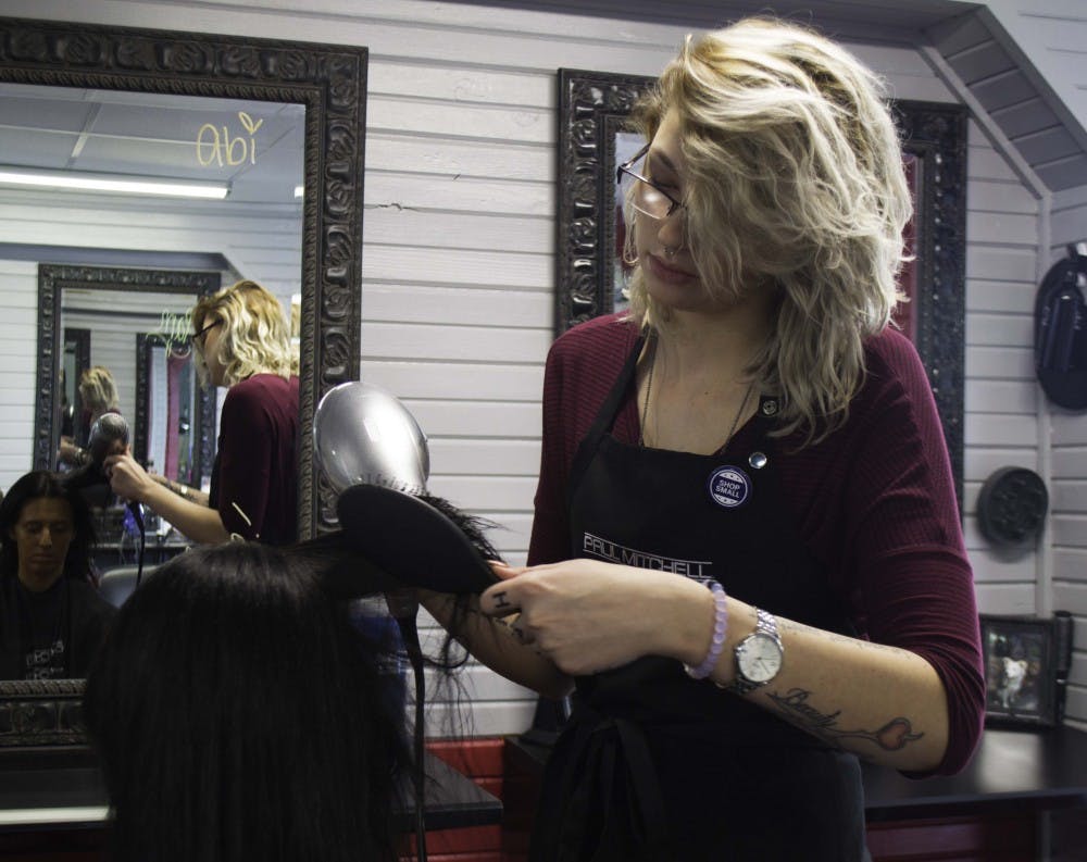 <p>Sophomore Abi Wright works at Hot Heads as a part-time stylist while being a full-time student at Ball State.&nbsp;Wright enrolled into beauty school her junior and senior years of high school.&nbsp;<em>DN PHOTO STEPHANIE AMADOR</em></p>
