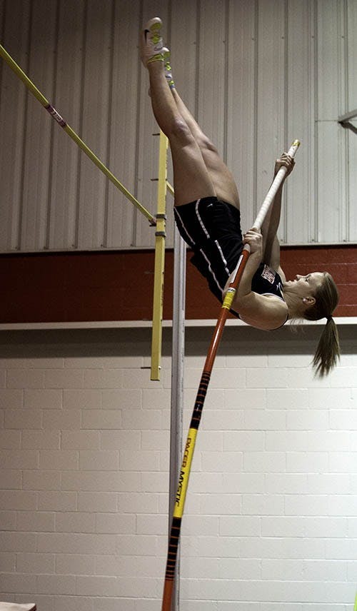 Hannah Ciasto-Poor competes in the Pole Vault against girls from Miami, Northern Illinois and Western Michigan. Hannah took second in Friday's meet with a score of 6.5 points.  DN PHOTO RJ RICKER