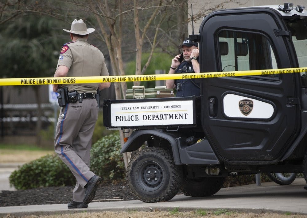 Law enforcement officers work the scene a shooting outside of the Pride Rock residence at Texas A&amp;M University-Commerce in Commerce, Texas, Monday, Feb. 3, 2020. (Juan Figueroa/The Dallas Morning News via AP)