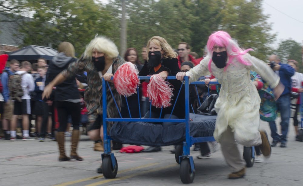A team takes off from the starting line for the annual Bed Races on Oct. 10 on Riverside Avenue for Homecoming Week. DN PHOTO BREANNA DAUGHERTY 