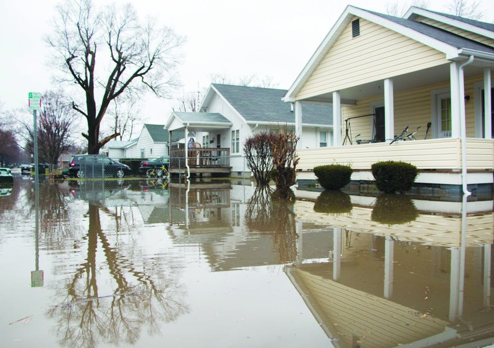 Flooding on North Ball Avenue caused water to rise above the curb and flood front yards April 3. Water in the basement of one of the homes rose to 3 feet. DN PHOTO TAYLOR IRBY 