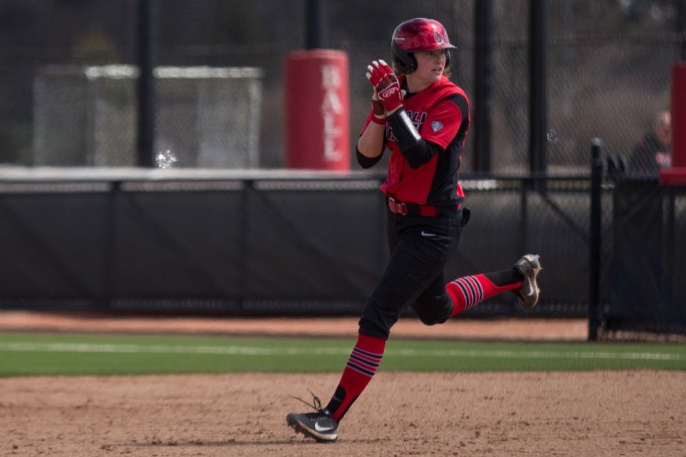 Junior Olivia Huffman cheers on her way to second base as one of her teammates scores in the second inning during the Cardinals' game against Kent State April 7 at the Softball Field at First Merchants Ballpark Complex. Eric Pritchett, DN