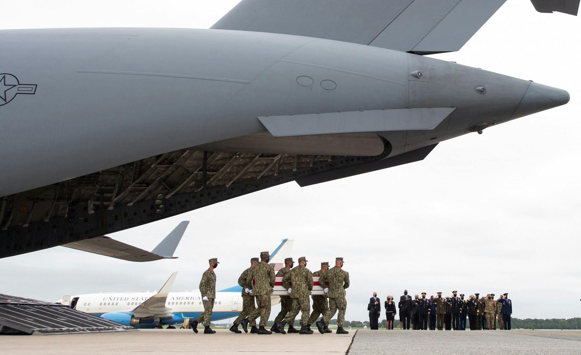 U.S. President Joe Biden and other officials attend the dignified transfer of the remains of fallen service members at the Dover Air Force Base in Dover, Delaware, Aug. 29, 2021, after 13 members of the U.S. military were killed in Afghanistan last week. U.S. troops officially left Afghanistan Aug. 30, ending their participation in a 20-year-long war. Saul Loeb/AFP via Getty Images/TNS, Photo Courtesy