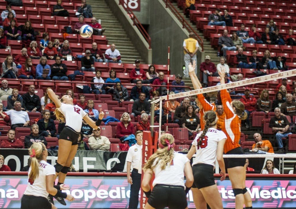 Sophomore setter Jenna Spadafora lines up her kill attempt against Bowling Green State University wall on Oct. 25. DN PHOTO JONATHAN MIKSANEK