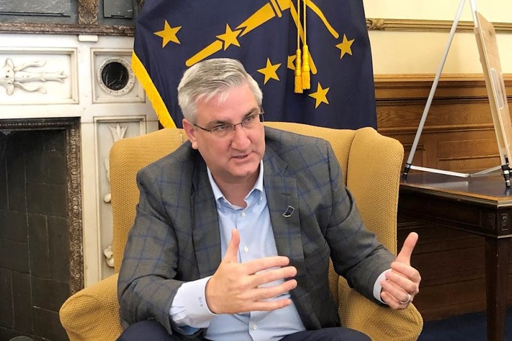 <p>Indiana Gov. Eric Holcomb speaks with reporters about the state's coronavirus response on Friday, March 13, 2020, at his Statehouse office in Indianapolis. Holcomb said he's leaving the decision on whether schools should be closed to local officials, unlike the Michigan and Ohio governors who've ordered statewide school closings. <strong>(AP Photo/Tom Davies)</strong></p>