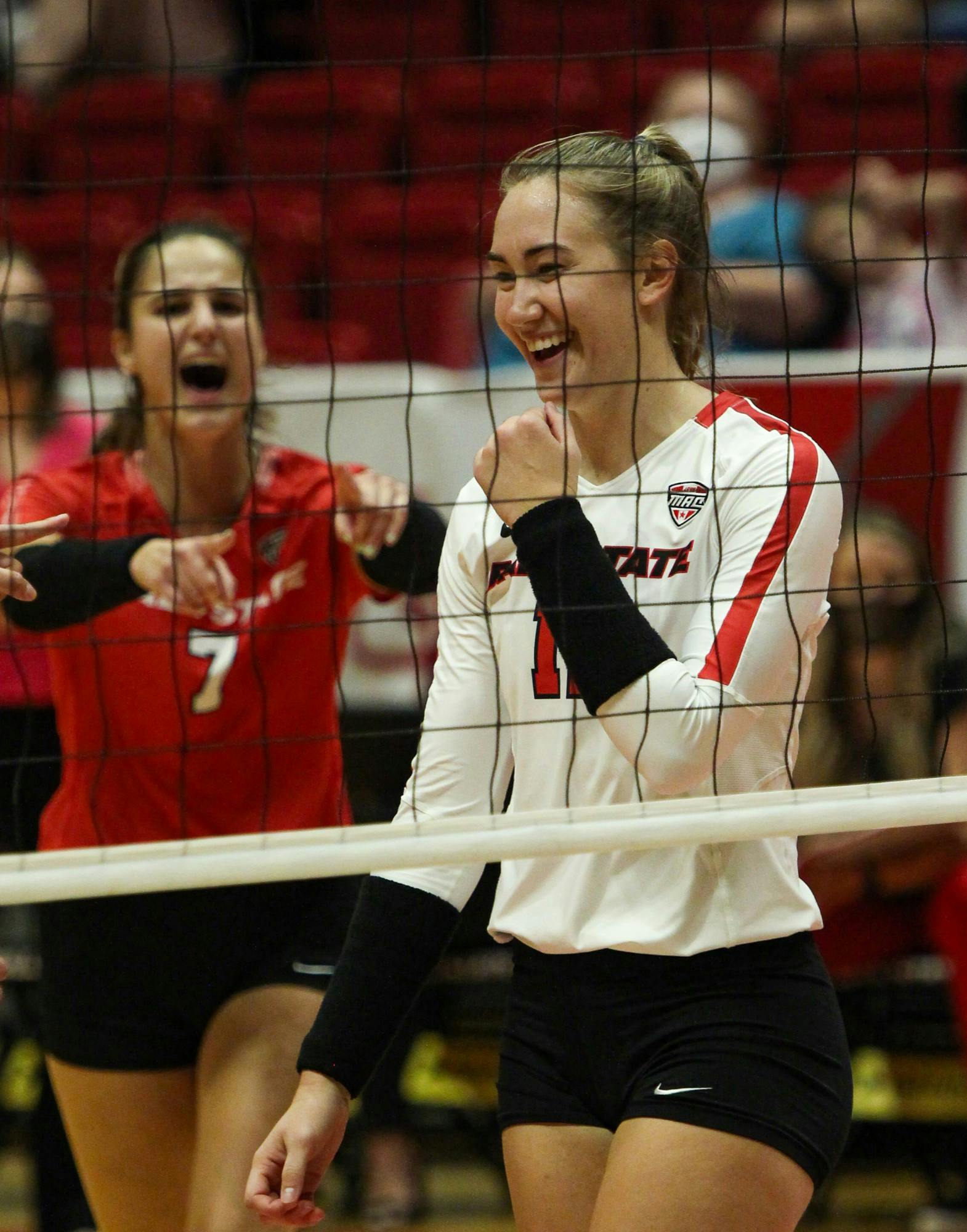 Sophomore middle blocker Lauren Gilliland (11) celebrated three successful blocks in a row against Ohio at Worthen Arena Oct. 1. Ball State will take on Akron Oct. 8. Jacy Bradley, DN
