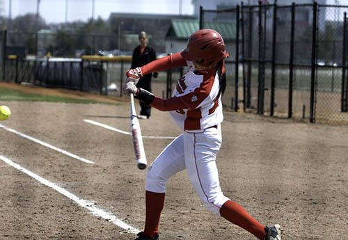 With bases loaded, Ball State junior Jennifer Gilbert bats in two runners with a line drive. Gilbert's hit brough the Cardinals' score to 3-2 in the second inning. Ball State won the first of two games against Northern Illinois 5-3. DN PHOTO RJ RICKER