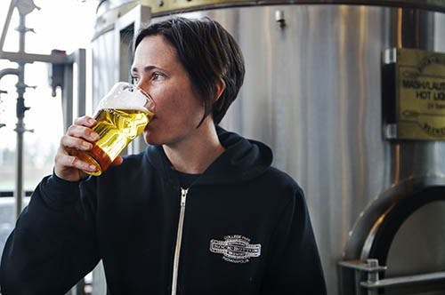 Liz Laughlin, head brewer at Rock Bottom Restaurant & Brewery in Indianapolis, takes a sip of her choice, a Cascadian Pilsner. Laughlin began brewing in Oregon in the early ‘90s. DN PHOTO TYLER STEWART