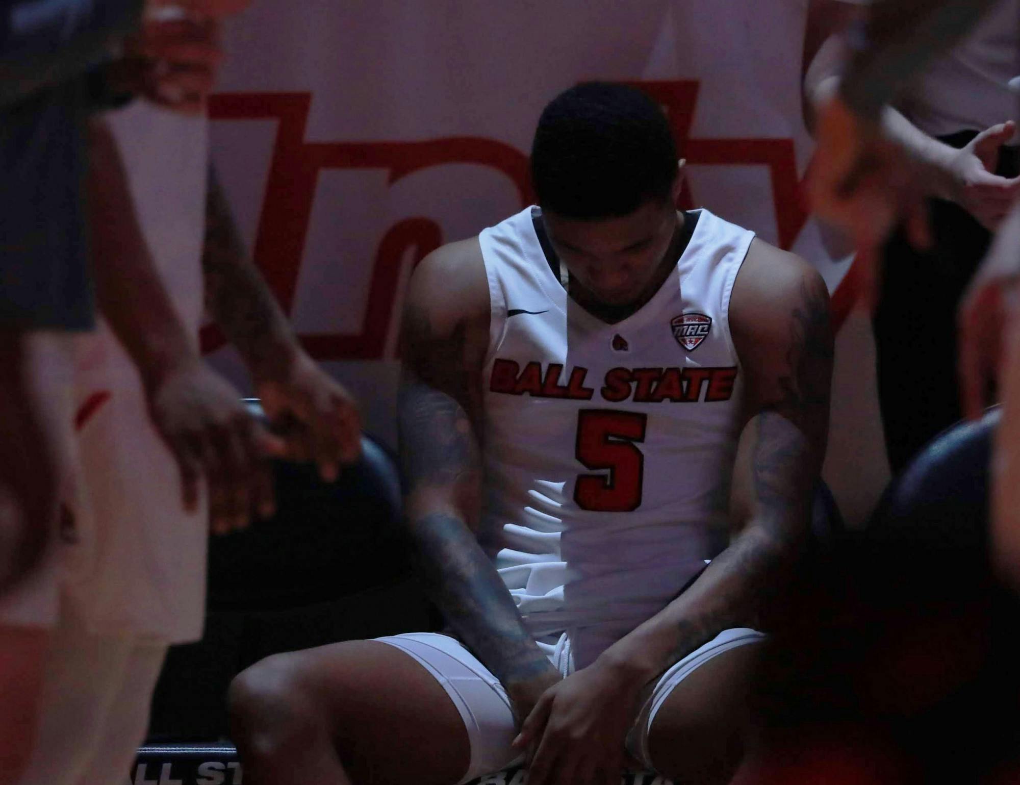 Junior guard Ishmael El-Amin bows his head and waits before his name is called Feb. 25, 2020, at John E. Worthen Arena. Jacob Musselman, DN