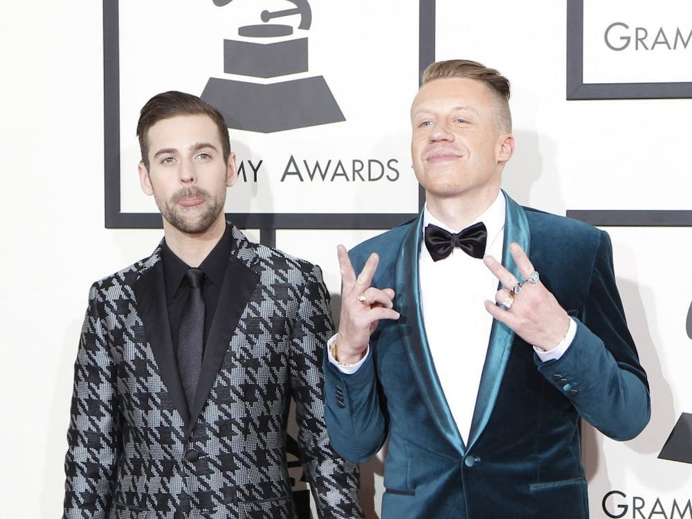 Recording artists Ryan Lewis, left, and Macklemore arrive for the 56th Annual Grammy Awards at Staples Center in Los Angeles on Sunday, Jan. 26, 2014.  (Wally Skalij/Los Angeles Times/MCT)