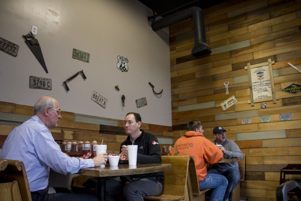 Guests eat at MT's Smokin' BBQ Feb. 15. Travis and Mandy Thorrington started this business as a food truck and now customers can enjoy their meals inside the new restaurant. Eric Pritchett, DN